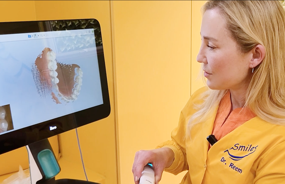 dr-reem-reviewing-digital-oral-scanner-image-pediatric-dentistry-modern-dental-technology